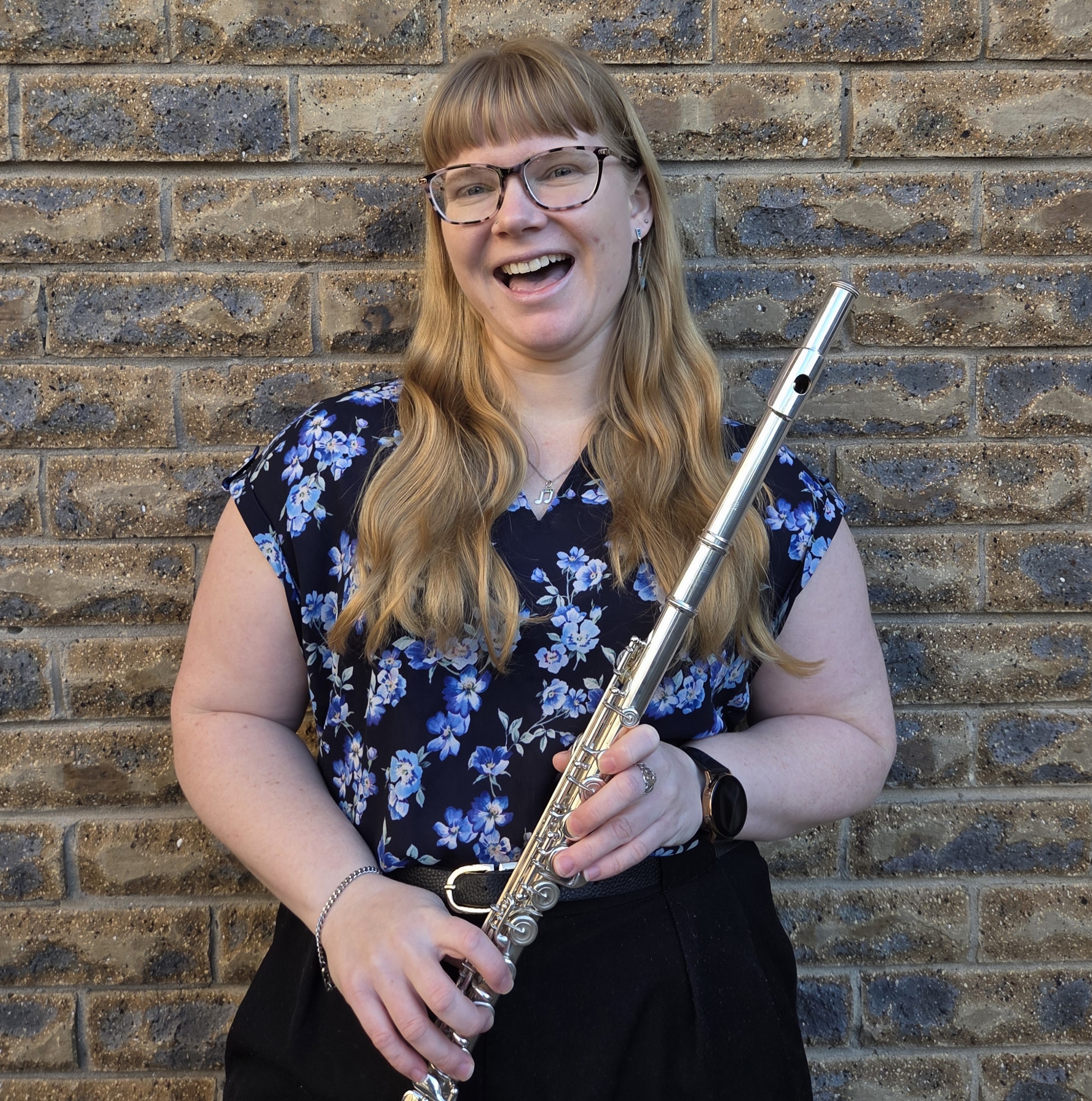 Woman holding a flute.
